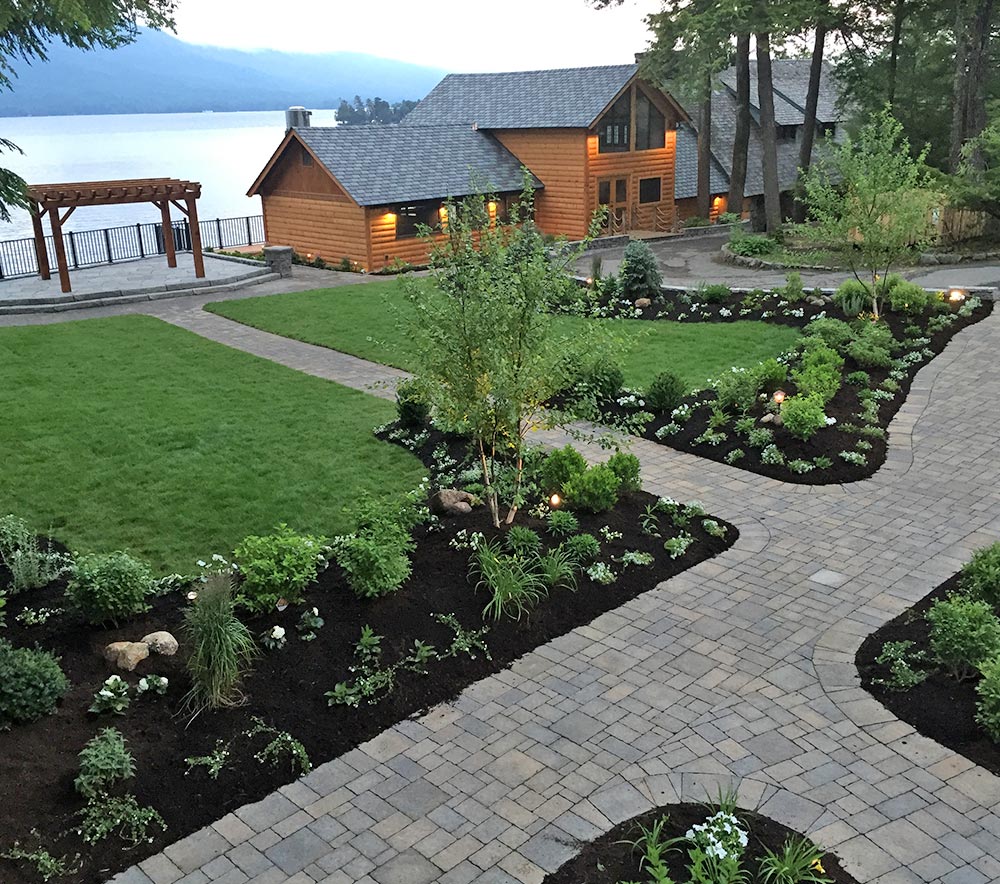 Landscaped property on ake with stone walkways and pergola